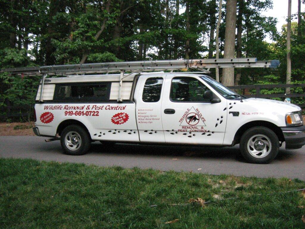 triangle wildlife removal work truck